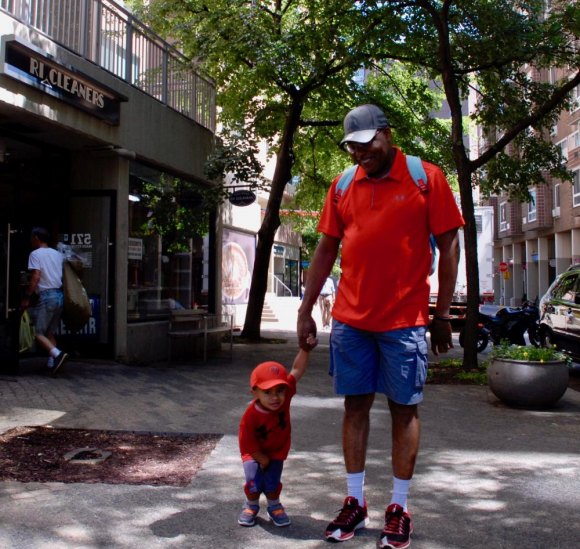 Roosevelt Island Day 2018 In Photos The long and the short of it, Alex Robertson escorted by his dad, Alonza.